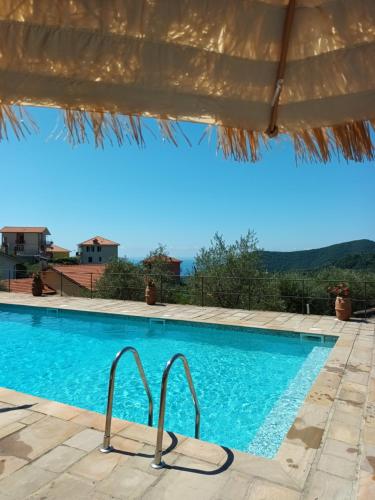 a swimming pool with a view of the mountains at Il Gelso in San Bartolomeo