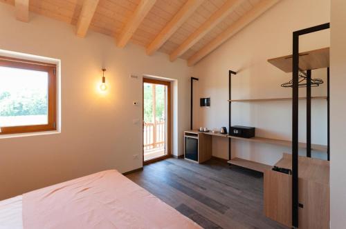 Posteľ alebo postele v izbe v ubytovaní Tenuta Della Casa Wine & Rooms - La Pausa del Collio