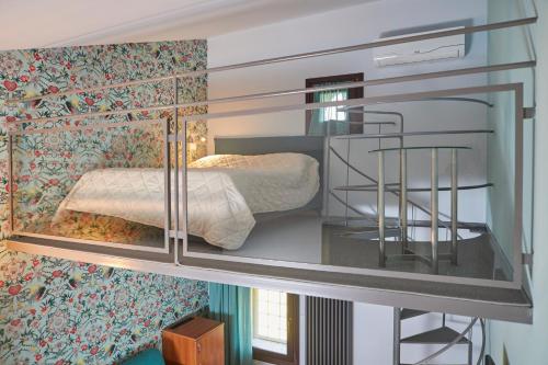 Letto o letti in una camera di Ca' Masieri Hotel
