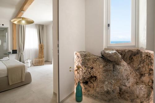 Posteľ alebo postele v izbe v ubytovaní Una Villa - Amalfi Boutique Rooms B&B