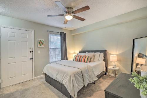 a bedroom with a bed and a ceiling fan at Auburn Condo with 2 Pools Less Than 2 Mi to University! in Auburn