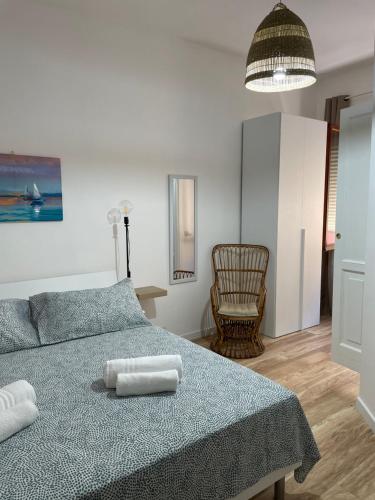 Postel nebo postele na pokoji v ubytování Aria di mare