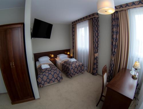 Hotel Imperial Residence tesisinde bir odada yatak veya yataklar