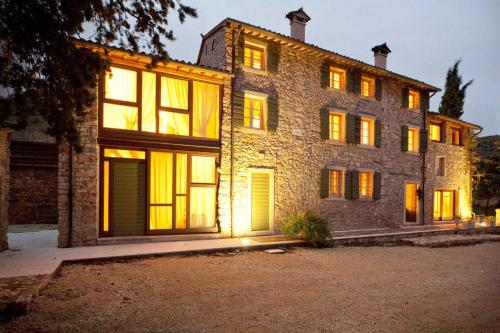 a large brick building with many windows at night at Antica Corte in Soave