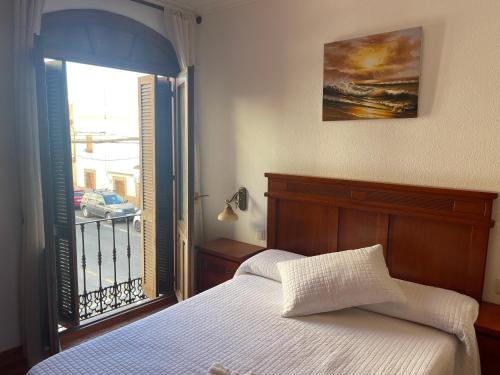Posteľ alebo postele v izbe v ubytovaní Apartamentos & Rooms JP