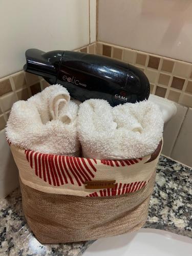 a hair dryer sitting on top of a basket at Cabañas La Suyana in Tafí del Valle