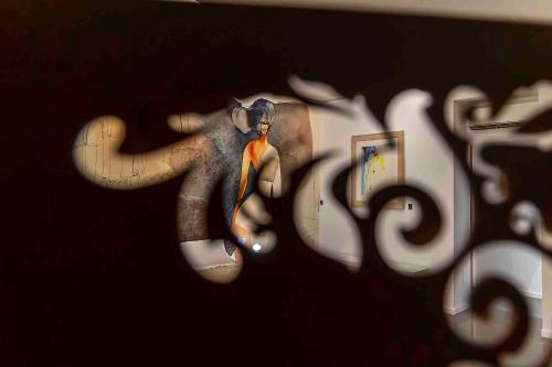 a drawing of an elephant with a tie on a wall at B&B Cantiere dell'anima - Rooms of art in Trapani
