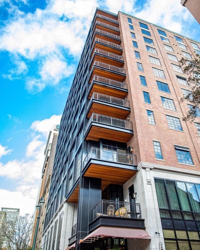 a tall building with balconies on the side of it at Virgin Hotels New Orleans in New Orleans