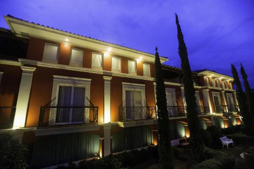 a large building with lights on it at night at Altos de Fontana by Macondo Collection in Managua