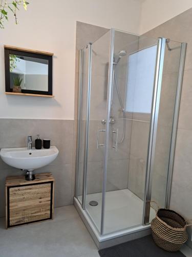 a bathroom with a shower and a sink at Waldstadt-Apartments in Iserlohn