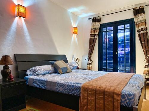 Ένα ή περισσότερα κρεβάτια σε δωμάτιο στο Maison Oualidia Vue sur Mer-Jardins de la Lagune