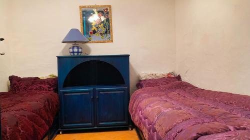 Ένα ή περισσότερα κρεβάτια σε δωμάτιο στο Maison Oualidia Vue sur Mer-Jardins de la Lagune