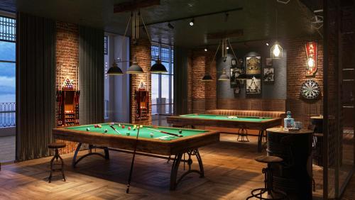 a billiard room with two pool tables in it at Holiday Inn Resort Ho Tram Beach by IHG in Ho Tram