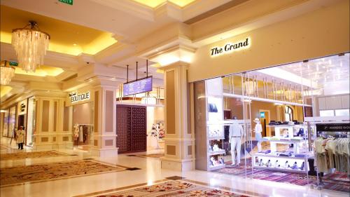 a fashion store with a large window in a mall at Holiday Inn Resort Ho Tram Beach by IHG in Ho Tram