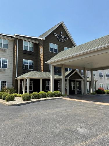 a building with a parking lot in front of it at Country Inn & Suites by Radisson, Marion, IL in Marion