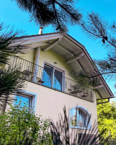 a building with a balcony on top of it at Villam Apartment in Maribor