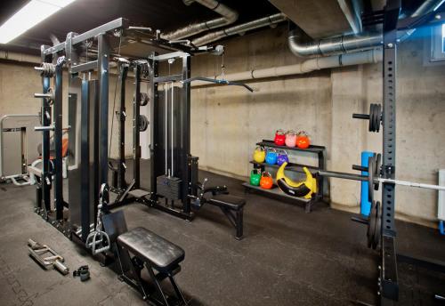 a room with a gym with equipment in it at Unique Baltic Apartments - Apartament z garażem in Kołobrzeg