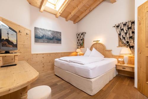 En eller flere senge i et værelse på Landhaus Dorfbäck