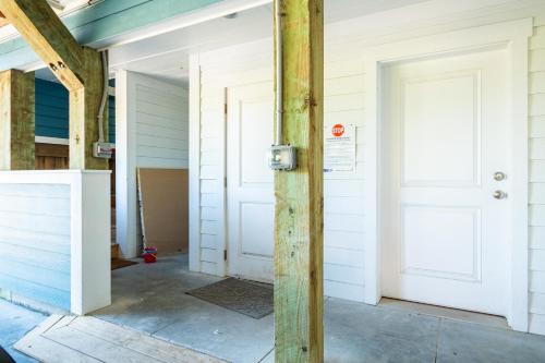 a front door of a house under construction at Turtle Watch Too by Oak Island Accommodations in Caswell Beach