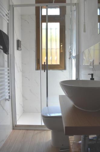 a bathroom with a sink and a toilet and a shower at Bed&Coffee Milano in Milan