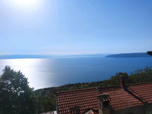 a view of the ocean from a house at Počitniška hiša Morski pogled in Mošćenička Draga