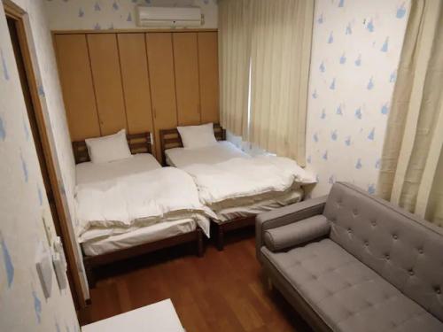 Un pat sau paturi într-o cameră la commun ryogoku - Vacation STAY 97137v