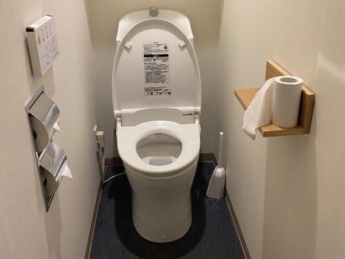a bathroom with a toilet with the lid up at commun ryogoku - Vacation STAY 96357v in Tokyo