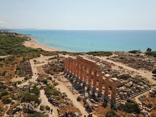 an aerial view of a temple next to the ocean at Sea View - Beautiful Terrace with BBQ in Triscina