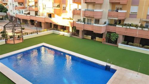 Swimmingpoolen hos eller tæt på APARTAMENTO PISCIS LITORAL