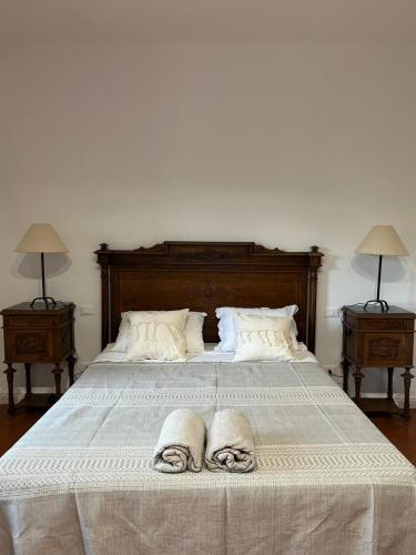 a bedroom with a bed with two towels on it at Casa Solatii Montefioralle in Greve in Chianti