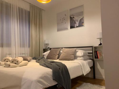 a bedroom with two beds with towels on them at Jahorina 7Lux in Jahorina