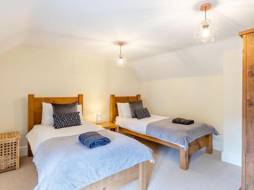 Ένα ή περισσότερα κρεβάτια σε δωμάτιο στο Bedehouse Cottage