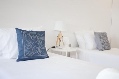 Postel nebo postele na pokoji v ubytování Pinheiro Guest House
