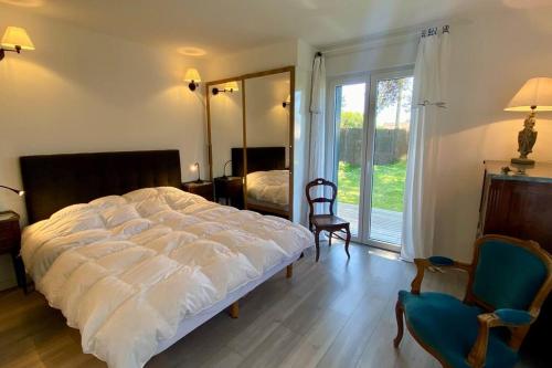 En eller flere senge i et værelse på Very pleasant single-storey villa for 6 people