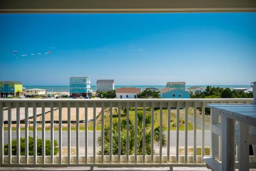a view of the beach from a balcony at The Anchor Holds by Oak Island Accommodations in Oak Island