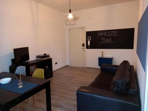 a living room with a couch and a table at Hauze Trani in Trani