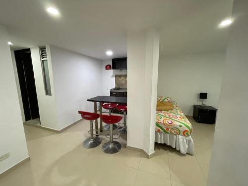 Kuchyň nebo kuchyňský kout v ubytování Lindos apartaestudios y habitaciones en Ibague