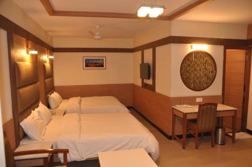 Cama ou camas em um quarto em Hotel SMS Grand Inn