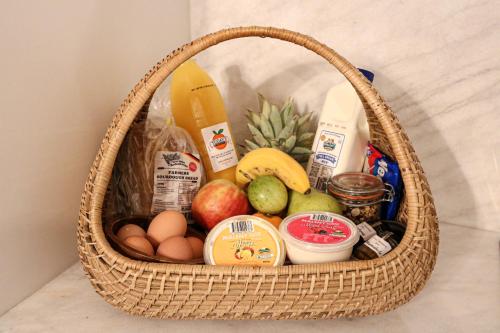 a basket full of food and groceries on a table at Narrows Escape Rainforest Retreat in Montville