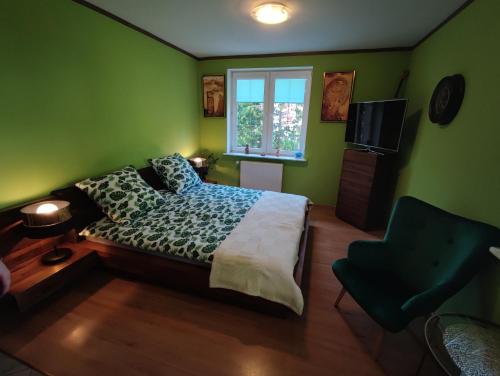 Ένα ή περισσότερα κρεβάτια σε δωμάτιο στο Ośrodek Varia