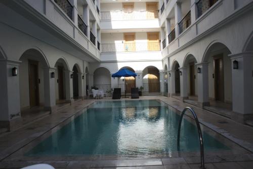 an indoor swimming pool in a building with a pool at Boracay Sands Hotel in Boracay