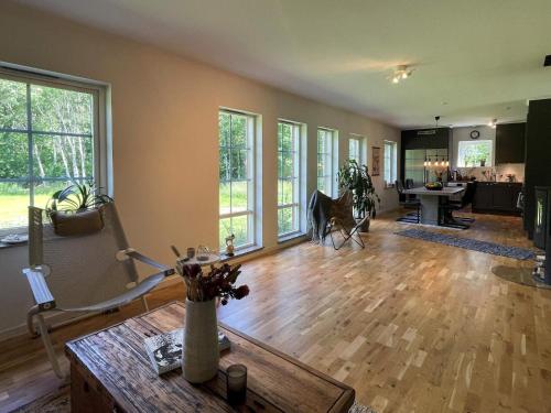 a living room with a wooden floor and a table at 5 person holiday home in KLÖVEDAL-By Traum in Klövedal
