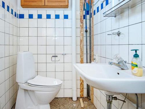 a bathroom with a toilet and a sink at 10 person holiday home in Ulfborg-By Traum in Ulfborg