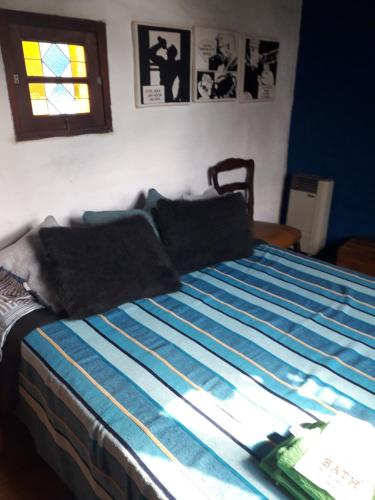 Ένα ή περισσότερα κρεβάτια σε δωμάτιο στο Hospedaje Casa Azul