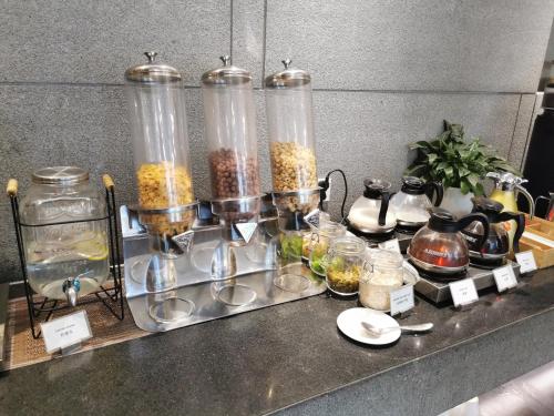 a counter with jars of food and other items on it at Sincere Residence Changfeng - Changfeng Ecological Business District - Near Exit 3 of Changfeng Park Station on Subway Line 15 in Shanghai