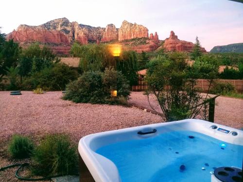 a tub in a yard with a view of the mountains at VIEWS! Uptown Sedona Utopia +Hot Tub in Sedona