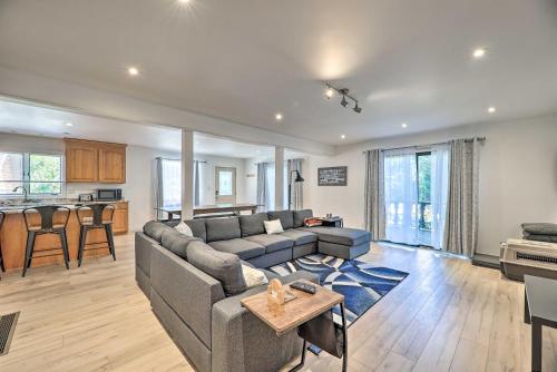 a living room with a couch and a table at 1 Mi to Tunnel Park Holland Home with Fire Pit in Holland