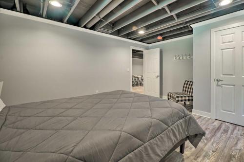 a bedroom with a large bed in a room at 1 Mi to Tunnel Park Holland Home with Fire Pit in Holland
