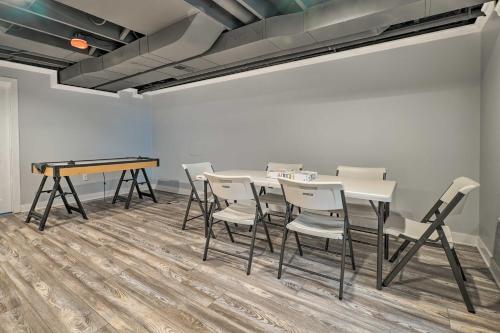 a table and chairs in a room with a table and a desk at 1 Mi to Tunnel Park Holland Home with Fire Pit in Holland