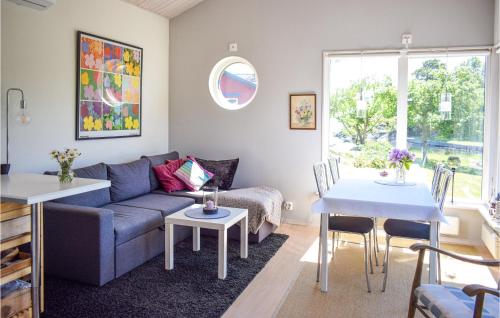 a living room with a couch and a table at 2 Bedroom Stunning Home In Oskarshamn in Oskarshamn